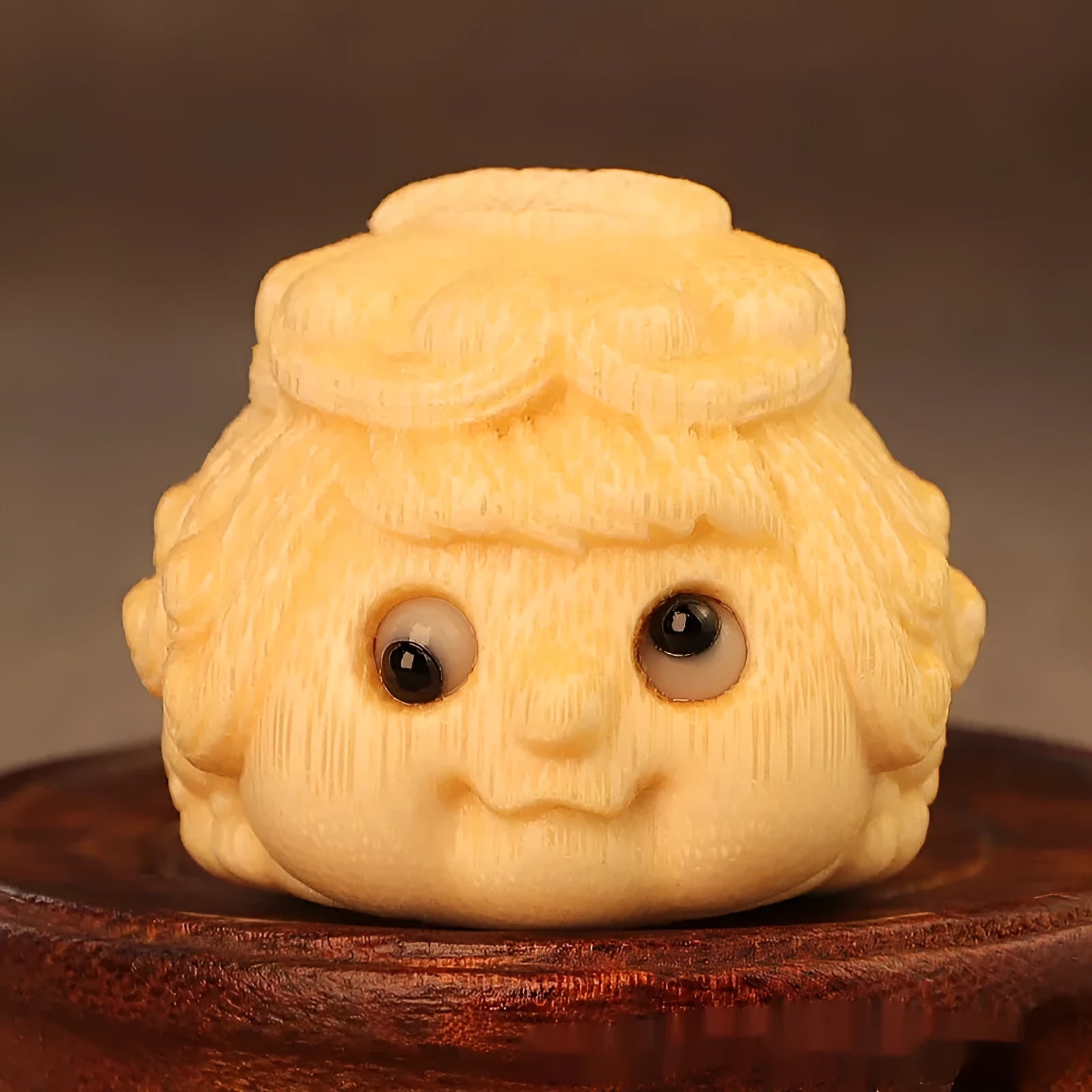 Solid bamboo golden toad princess ornament on a surface
