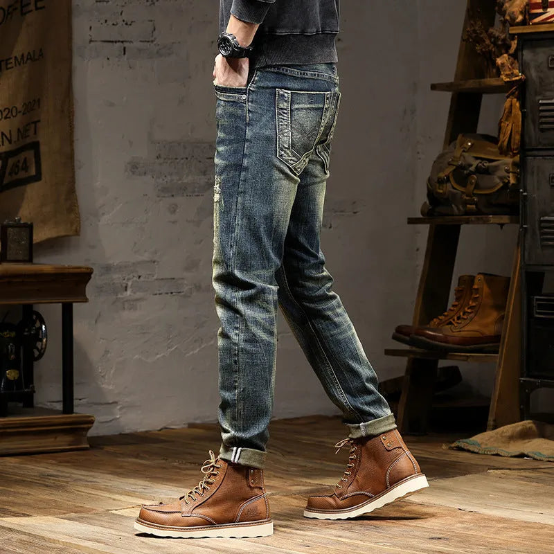 Men's skinny jeans in retro colour with zip fly, showing stretch denim fabric and slim pencil pants cut