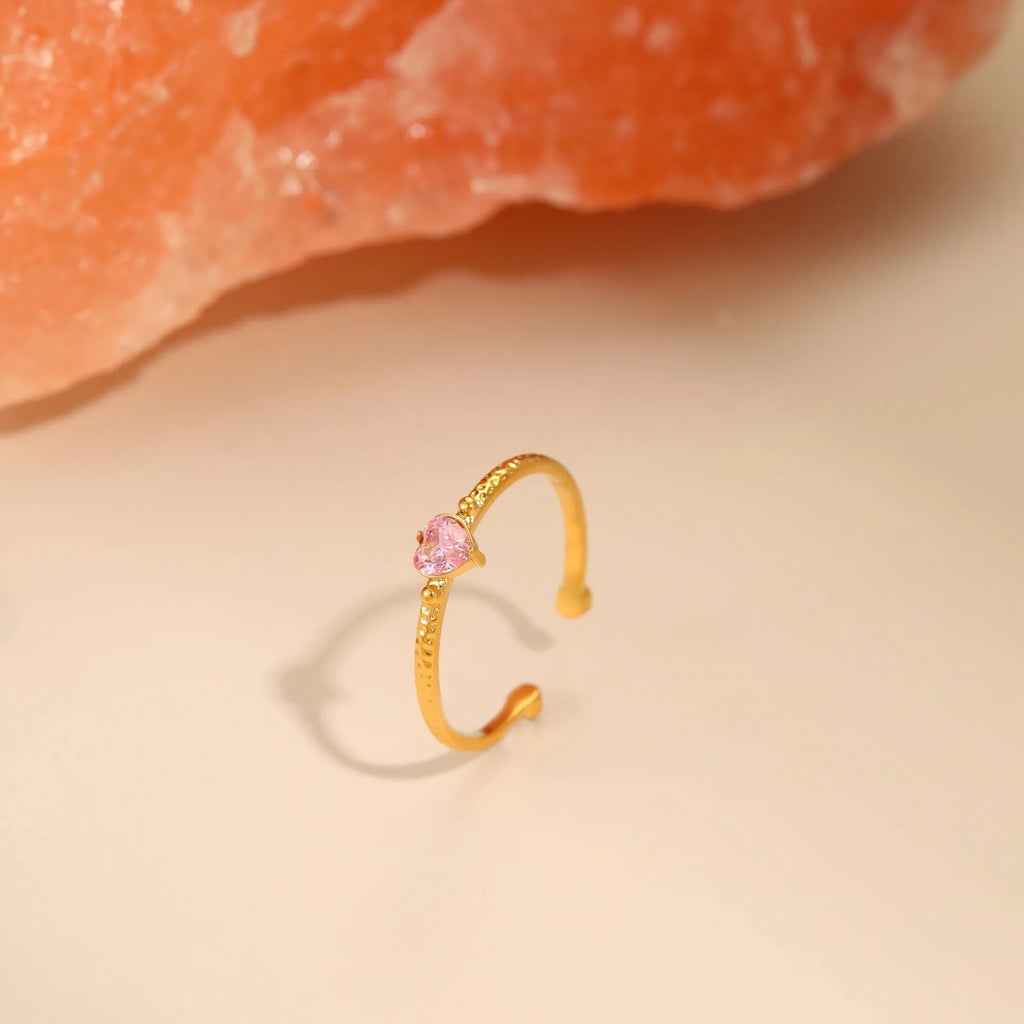 Geometric open-ended ring with heart-shaped zircon inlay in stainless steel