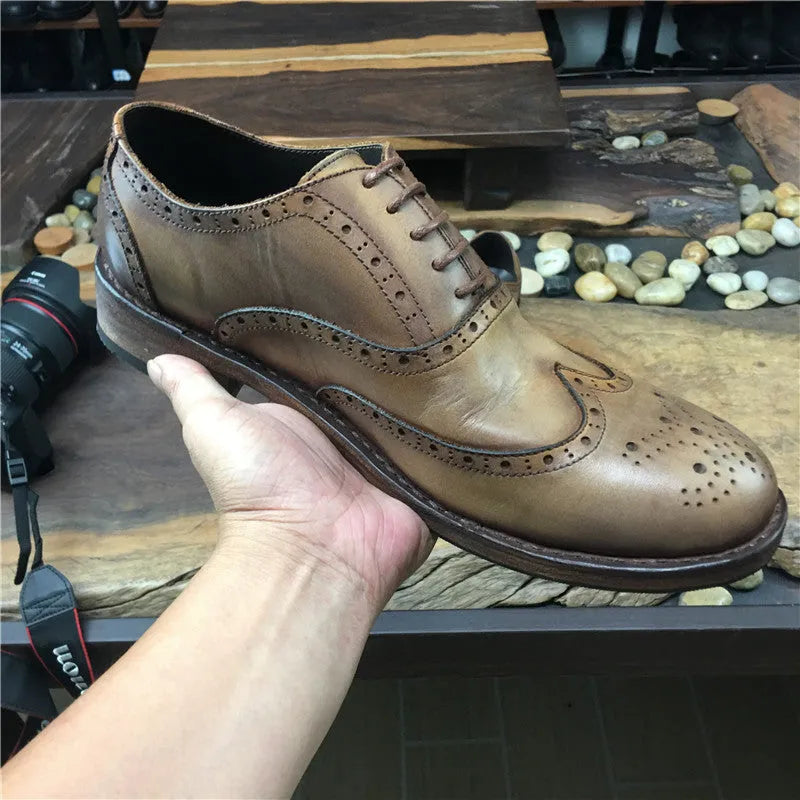 Men's light brown leather shoes with engraved distressed detailing and lace-up closure