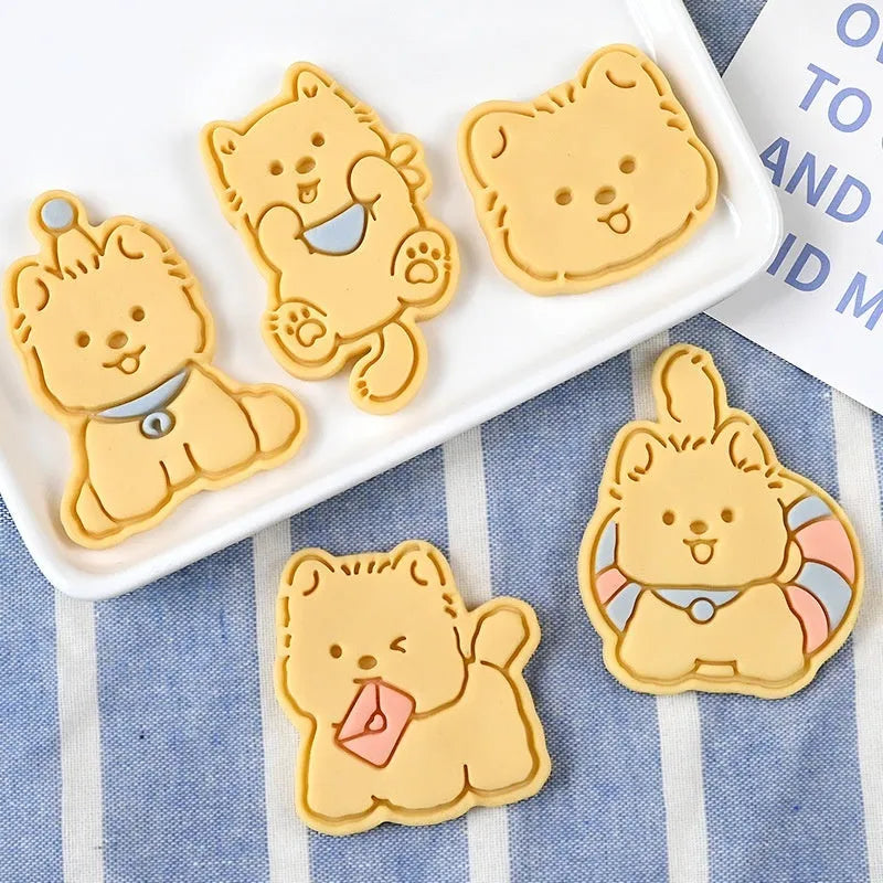 Plastic biscuit mould showing three-dimensional puppy head design with birthday hat for baking