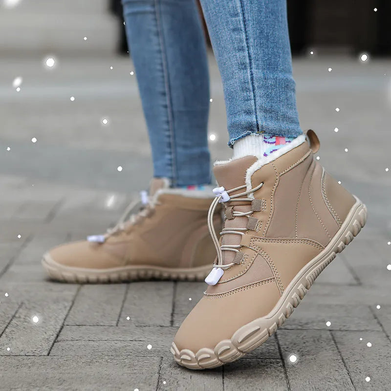 A pair of waterproof fleece-lined outdoor snow boots with a round toe, front laces, and a rubber sole.