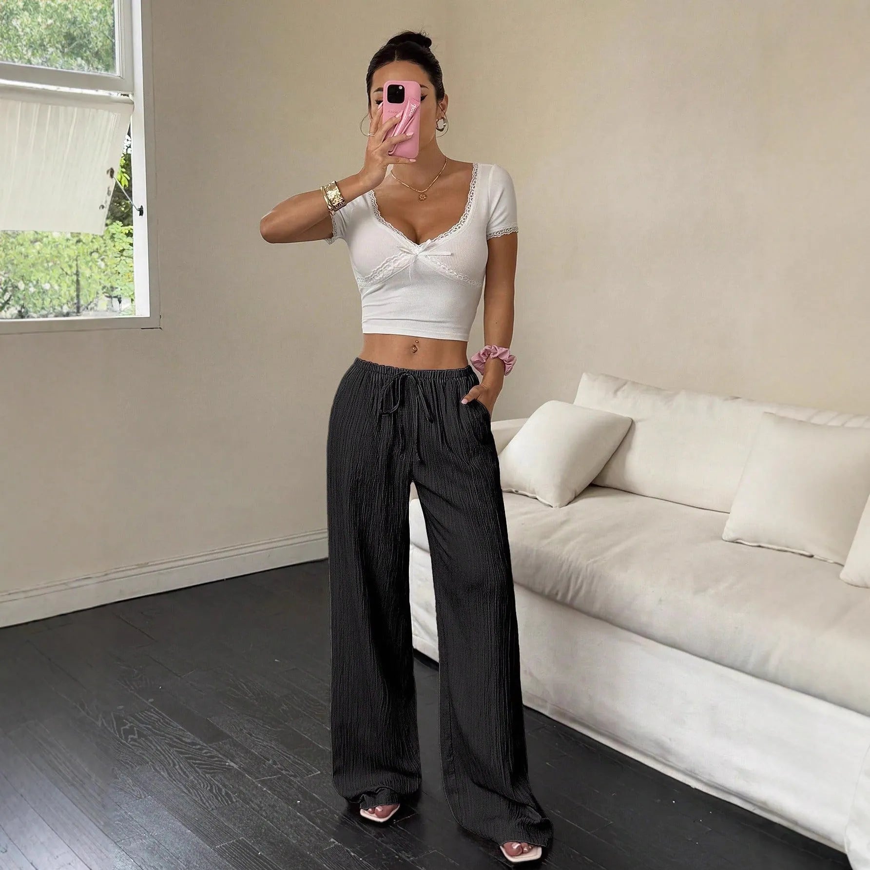 Women's wide-leg trousers with lace-up waist trimming in black and pink polyester fabric