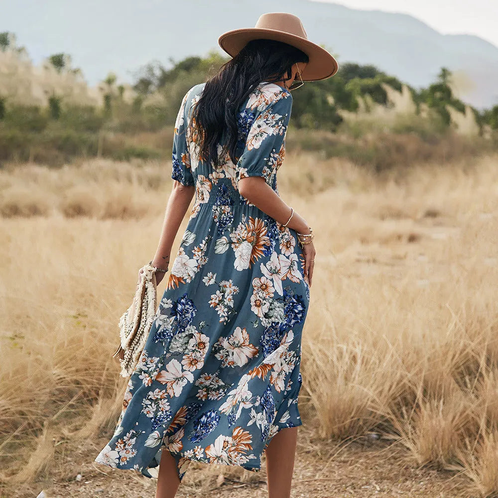 Women's floral print summer dress with V-neck, elastic waist, and large hemline skirt in yellow colour