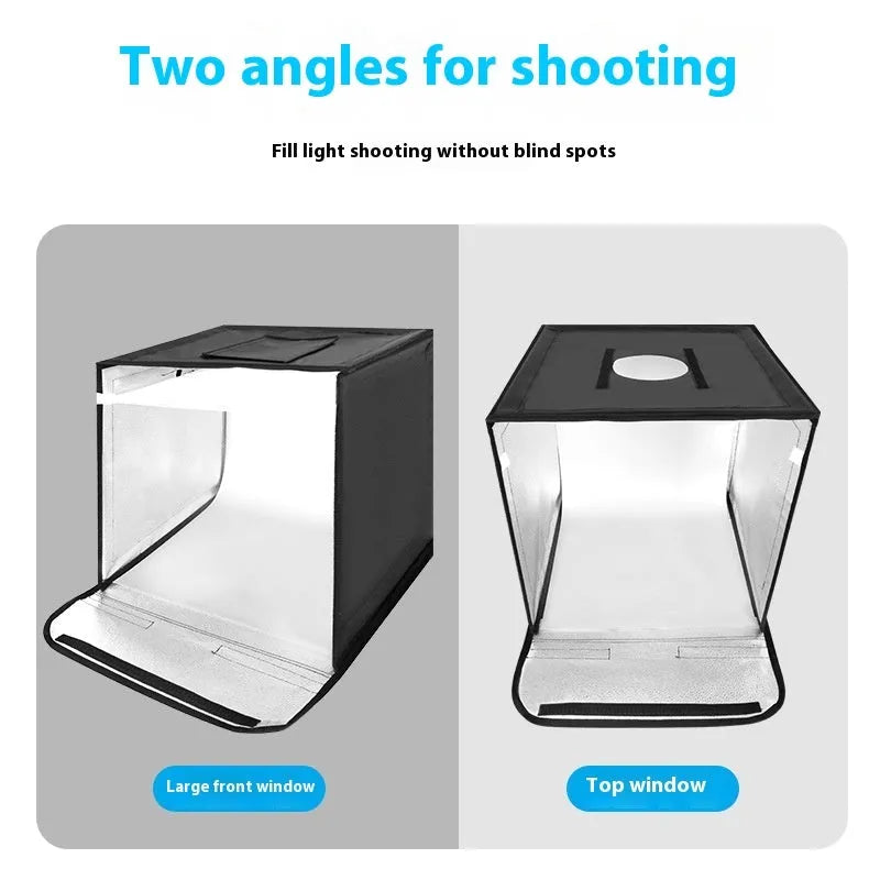 Foldable 50cm studio photo light box with integrated three-colour LED panel and reflective cloth interior.