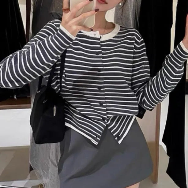 Dark grey and white striped slim fit women's cardigan with long sleeves.