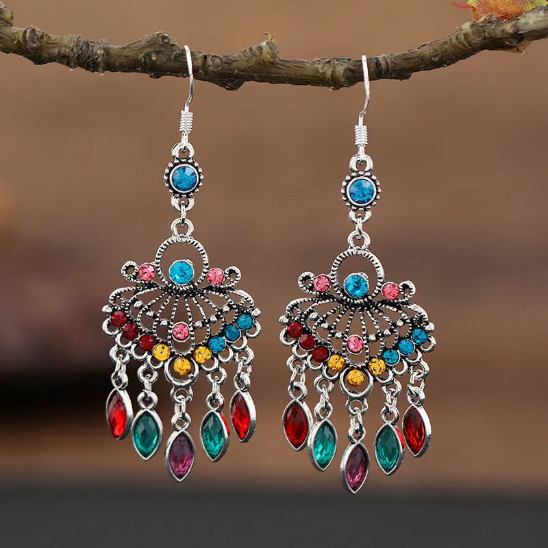 Pair of long purple drop earrings with a cascading fringe design and retro ethnic style.