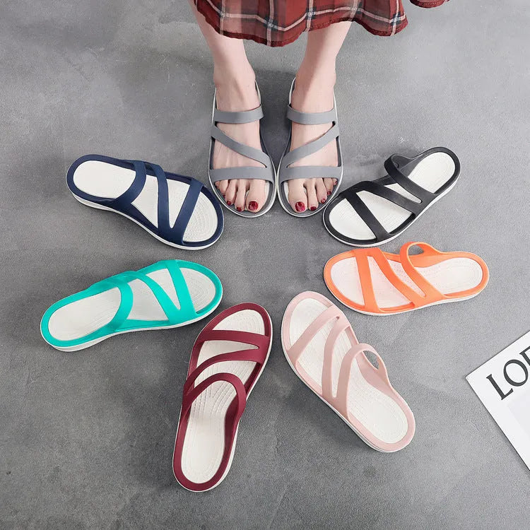 Women's solid colour breathable summer sandals in red, shown from the side.