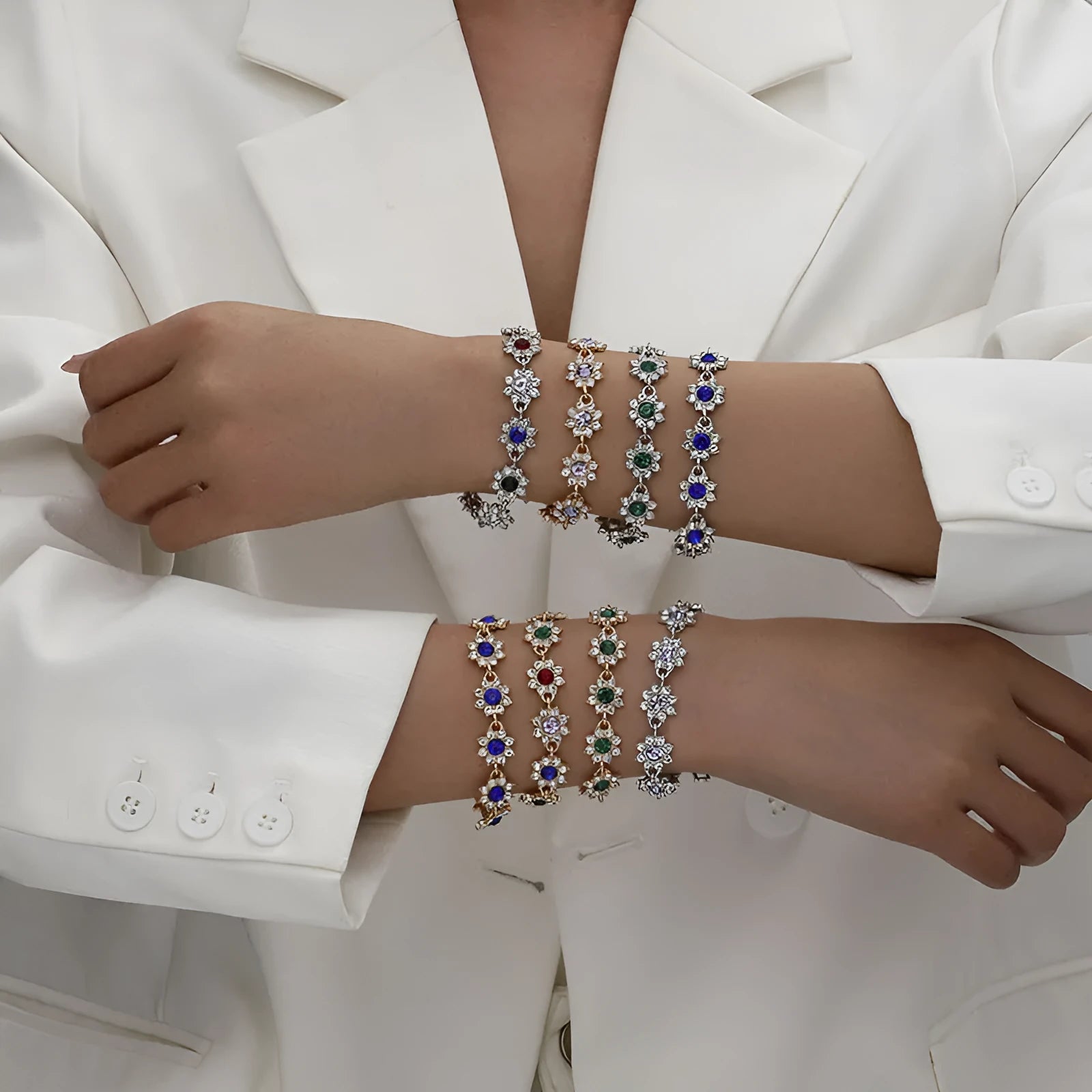 Electroplated zinc alloy flower bracelet in a choice of gold or silver finishes with coloured gemstone designs.