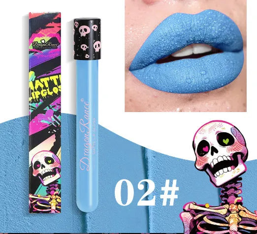 Halloween creative makeup lip gloss in skull-shaped test tube packaging, showing a matte gold and silver finish.