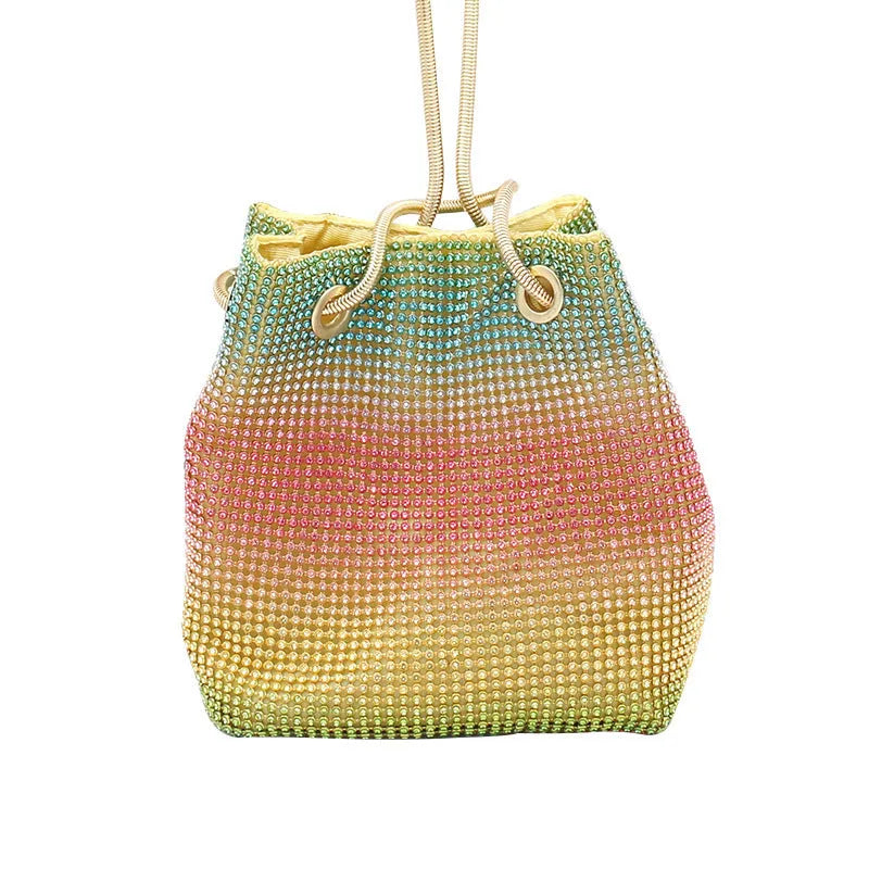 Rhinestone-decorated rainbow bucket bag with shoulder strap on a soft fabric base