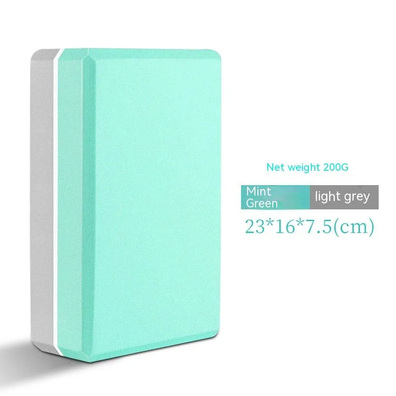 High-density EVA yoga block in violet colour next to a pink block with a cartoon print design.