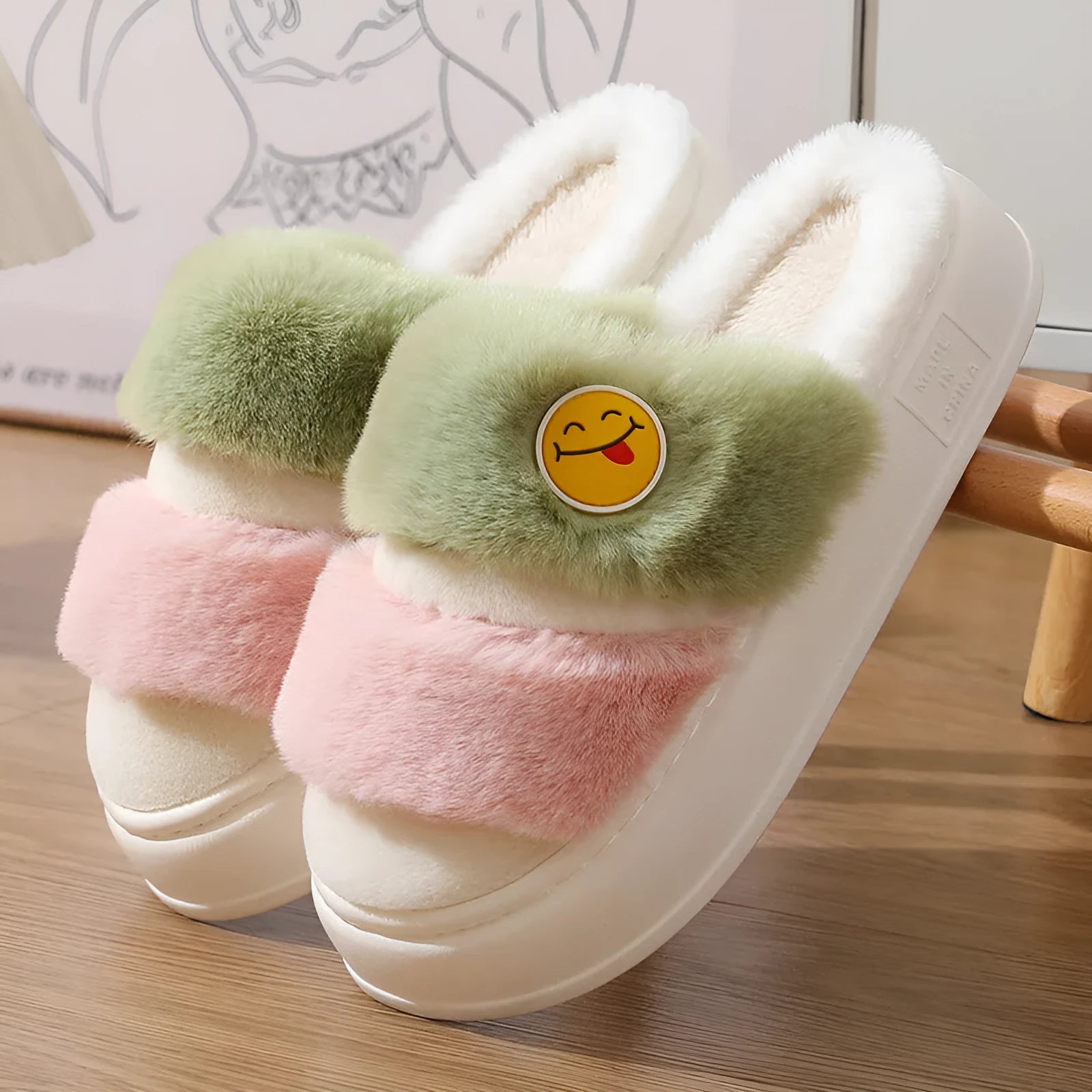 Cartoon-style pink and green thermal plush slippers with cashmere lining.