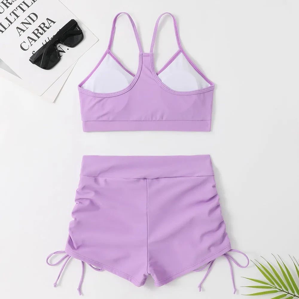 Women's high waist split swimsuit bikini in black or purple colour with briefs styling