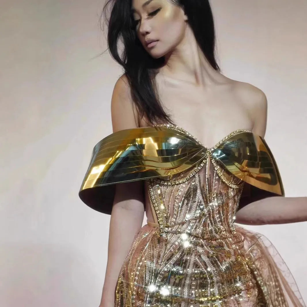 Gold women's strapless sequined dress with a split tulle skirt, long length, and mid waist fit