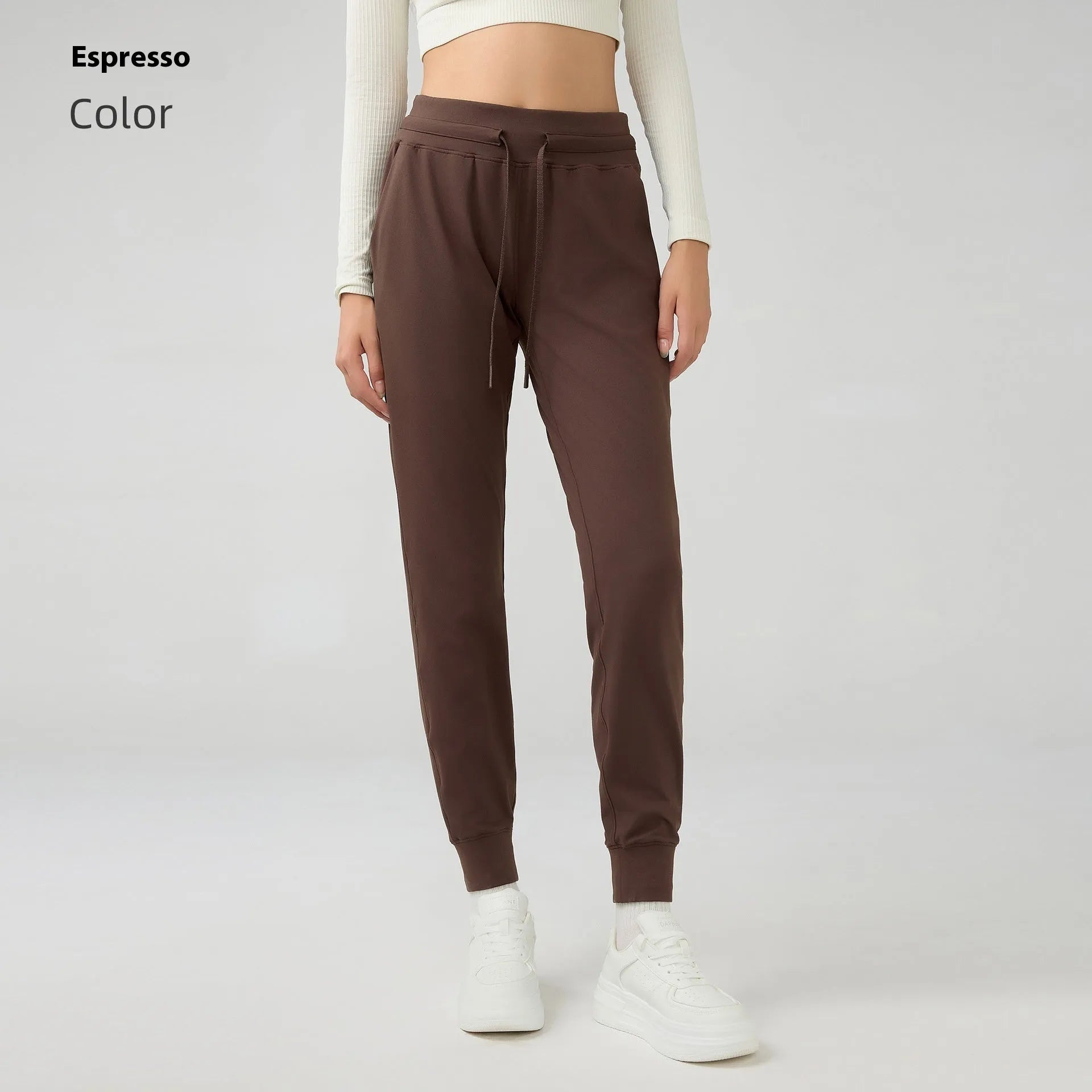Women's high-waist yoga pants with drawstring waistband in a cotton blend fabric.