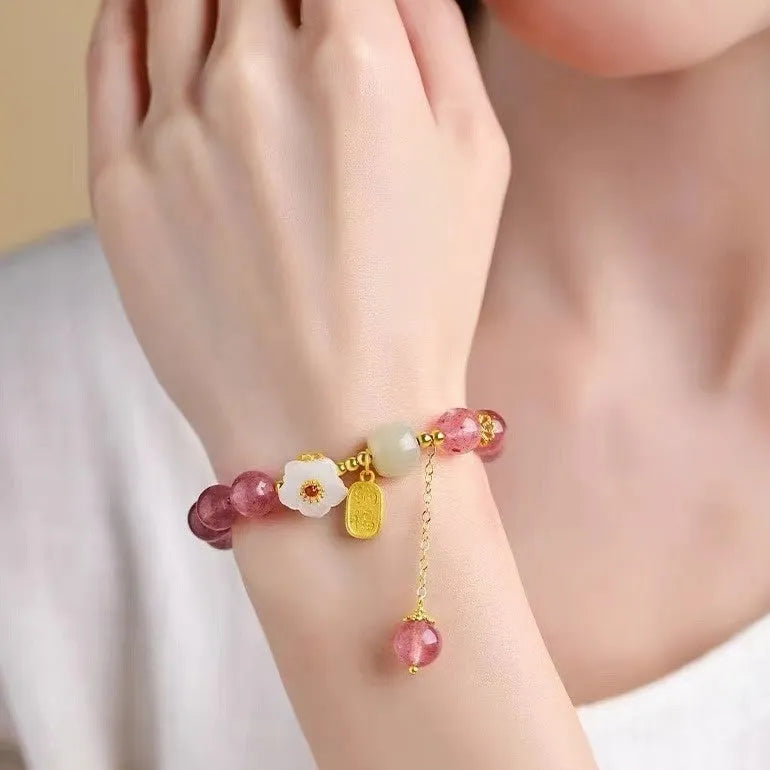 Handmade natural crystal bracelet with strawberry quartz decorative elements in pearl, moon, XINGX, or green design options