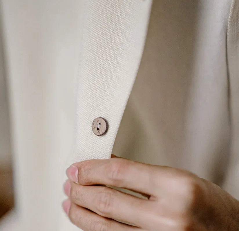 Light apricot men's shirt with bamboo plant pattern and Cuban collar on hanger