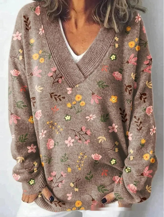 Women's V-neck long sleeve sweatshirt with a blue and white 3D floral print pattern.