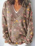 Women's V-neck long sleeve sweatshirt with a blue and white 3D floral print pattern.