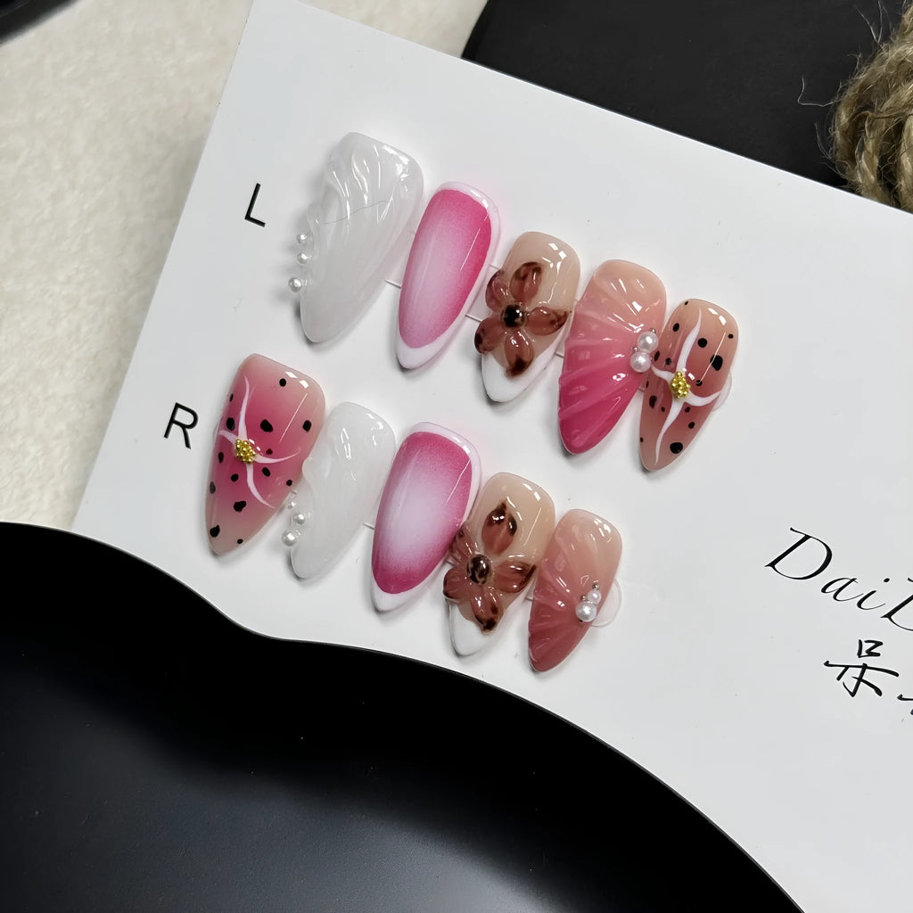 Hand-painted three-dimensional carved nail art patches in embossed candy colours, showing almond shape.