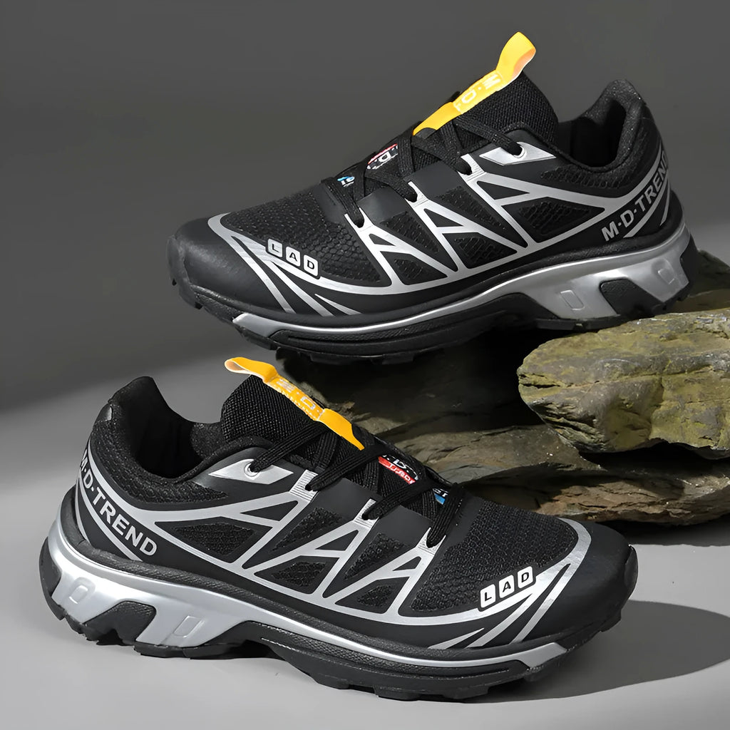 Low-top hiking shoes in khaki with rubber soles and front lace-up closure.