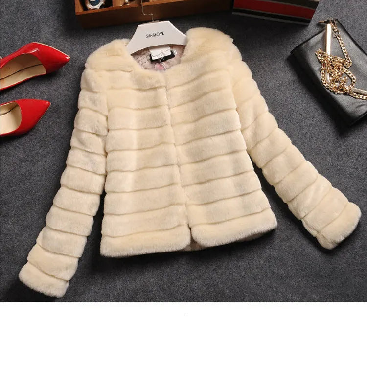 Women's short-length faux fur top in beige, black, or white with regular sleeves.