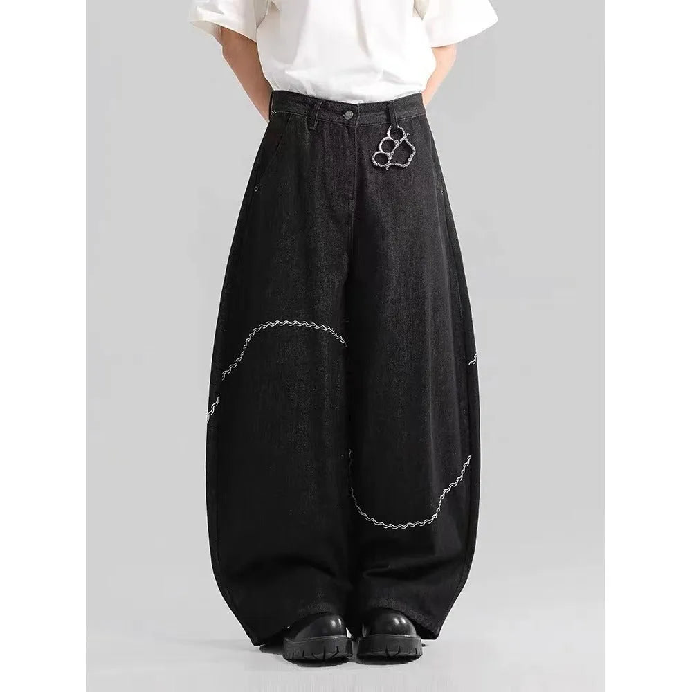 Men's black straight-leg jeans with a mid waist and zip fly, shown laid flat.