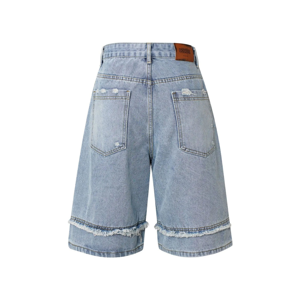 Men's distressed denim shorts with raw edge detailing in straight leg cropped silhouette