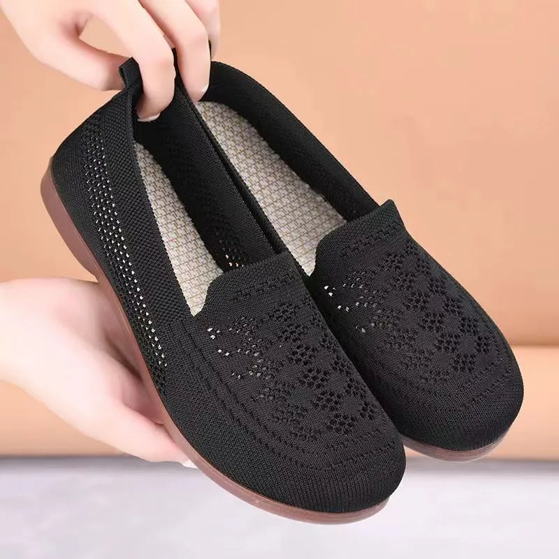 Beige women's low-top mesh casual shoes with a round toe and lightweight PVC sole.