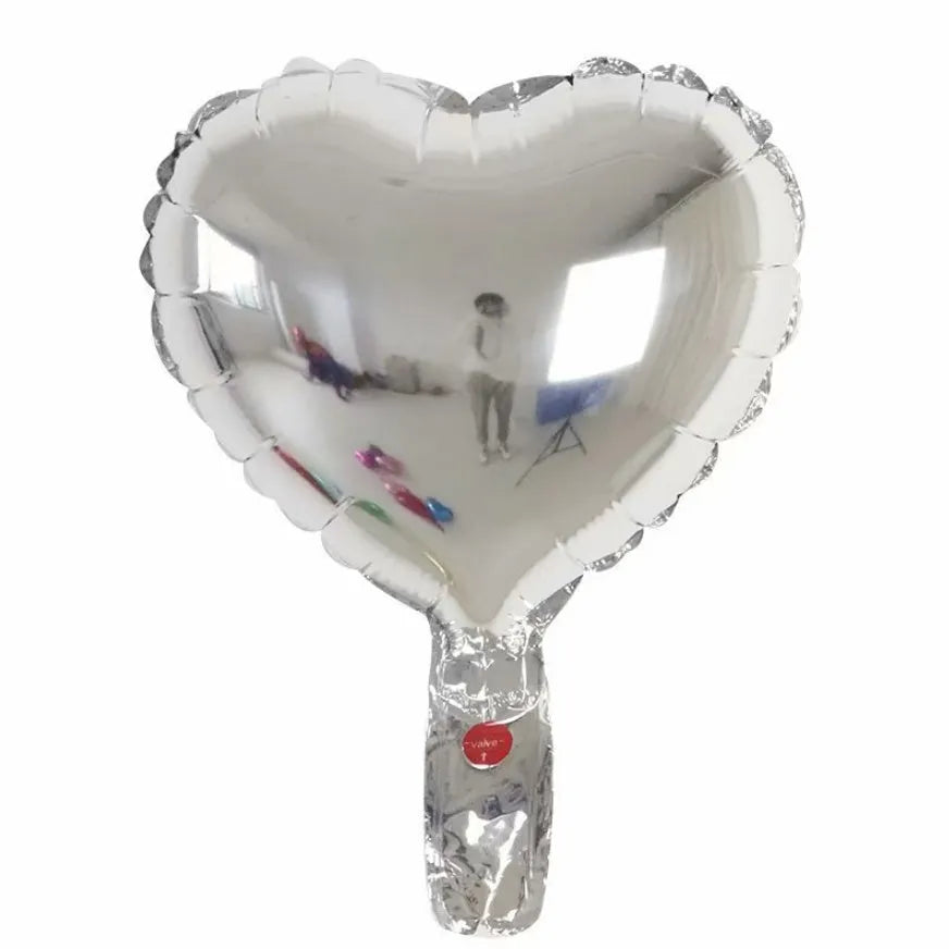 Five peach heart-shaped aluminium balloons in metallic colours for party decorations