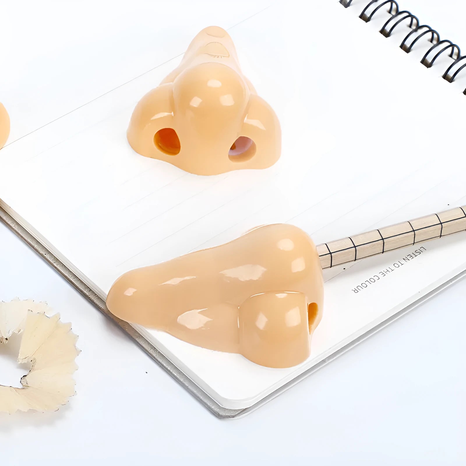Flesh colour plastic manual pencil sharpener with geometry shape and big nostril hole