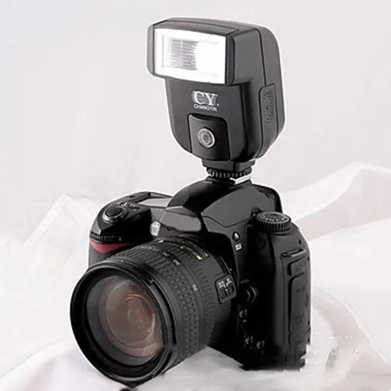 SLR camera hot shoe flash accessory with 90-degree tilt adjustment, shown with AA batteries for scale