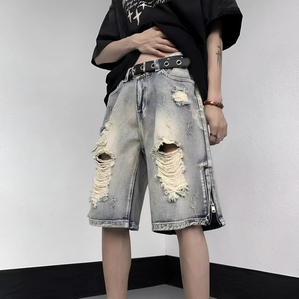 Blue distressed denim shorts with wide-leg loose fit and retro tattered styling on hanger
