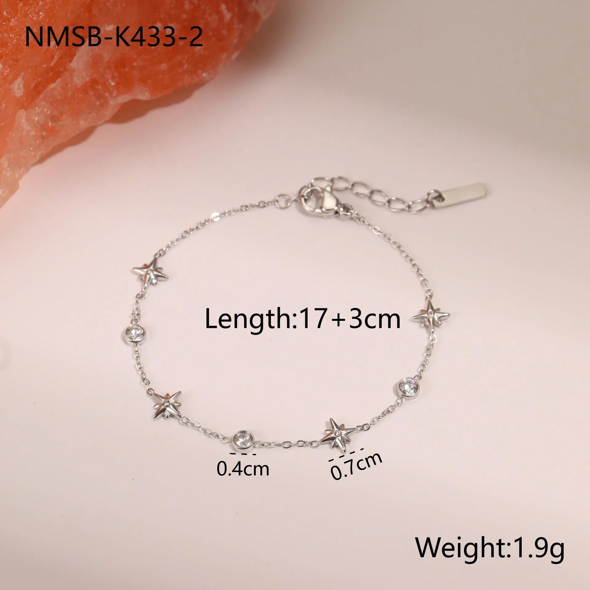 Stainless steel women's bracelet with geometric star pendant featuring hexagonal elements and gold plating