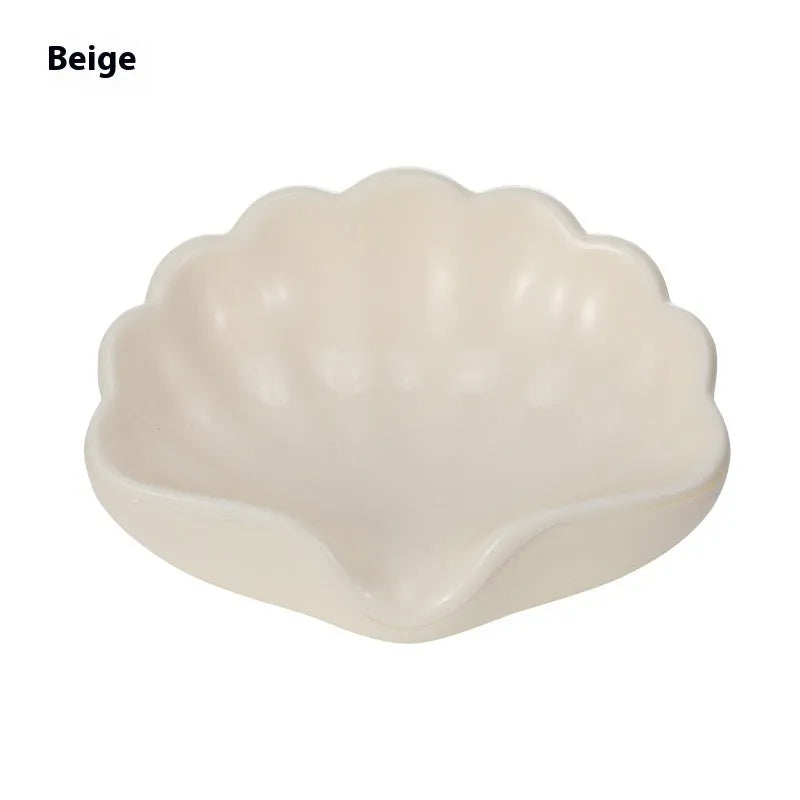 Shell-shaped plastic soap dish in white or pink for bathroom use