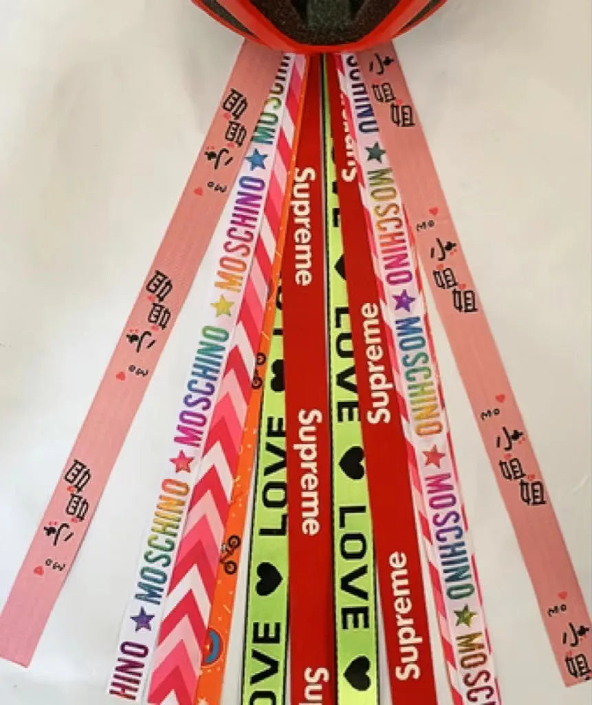 Children's decorative helmet streamer ribbon in multiple colours for roller skating and skiing safety gear.