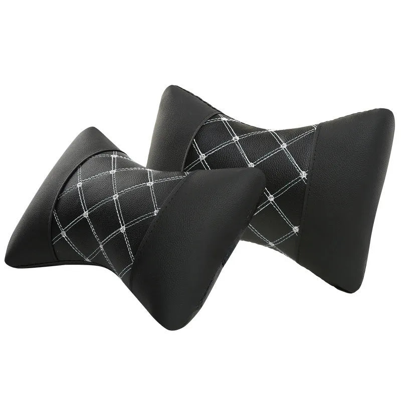 Black leather quilted car headrest pillow with contrast piping for cervical neck support