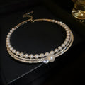 Curved collar-clavicle necklace with geometric silver-ball design in electroplated silver finish