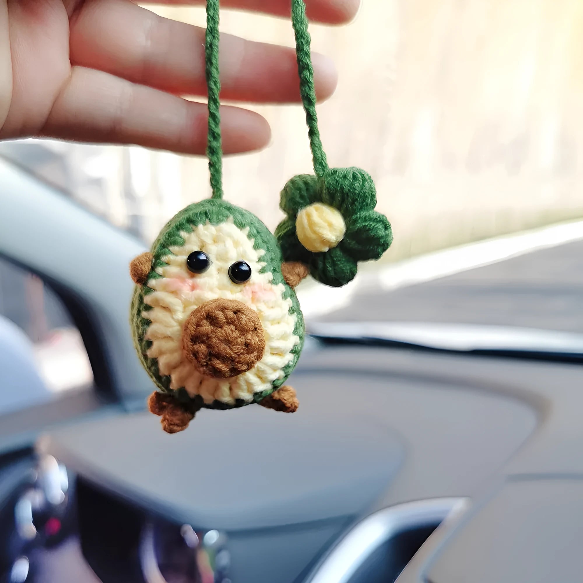 Handmade crocheted car pendant in avocado, pink rainbow, and red rainbow colour designs