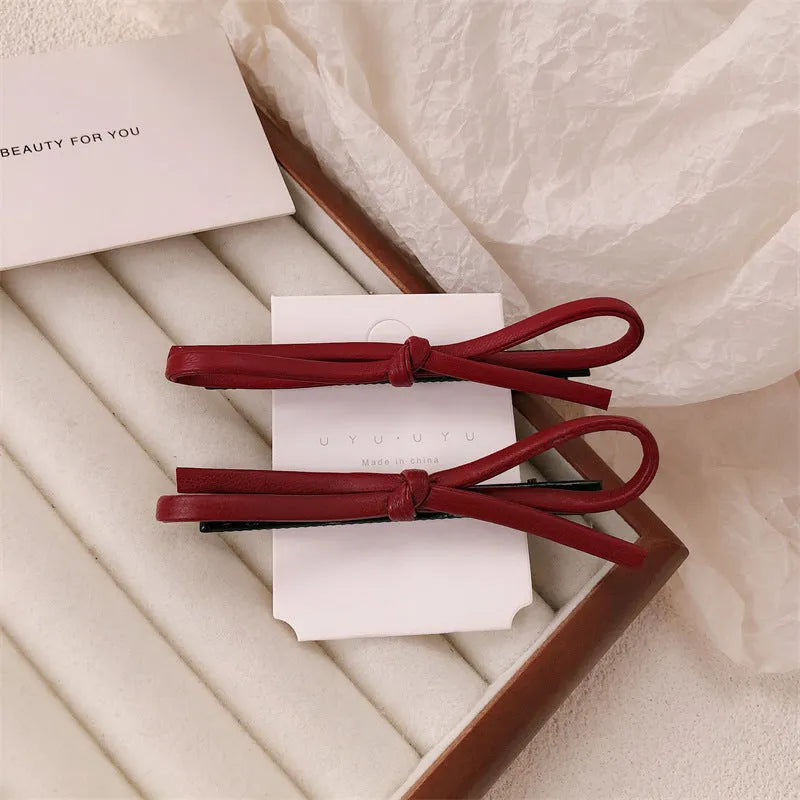 Wine red leather bow barrettes hair clips handcrafted construction