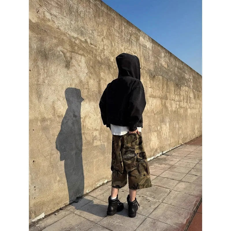 Men's loose camouflage jeans with retro patches and ripped detailing in cropped straight cut