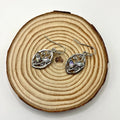 Silver leaf-shaped women's earrings with embedded colourful moonstones
