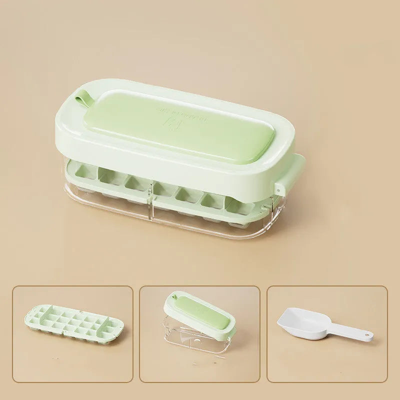 Blue high-capacity ice cube tray with integrated storage for an ice shovel.
