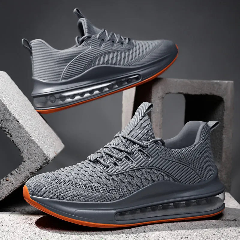 Men's low-top black mesh running shoes with lace-up front and rubber sole.