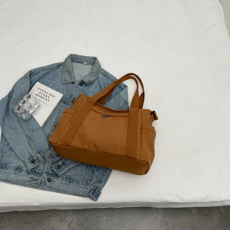 Women's polyester canvas shoulder bag with large capacity and mobile phone pocket in solid colour