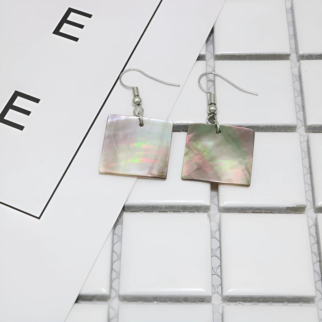 Women's geometric shell earrings in square panther or rectangular shell designs with natural material texture