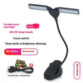 Black rechargeable music stand lamp with 28 LEDs attached to a metal music stand.