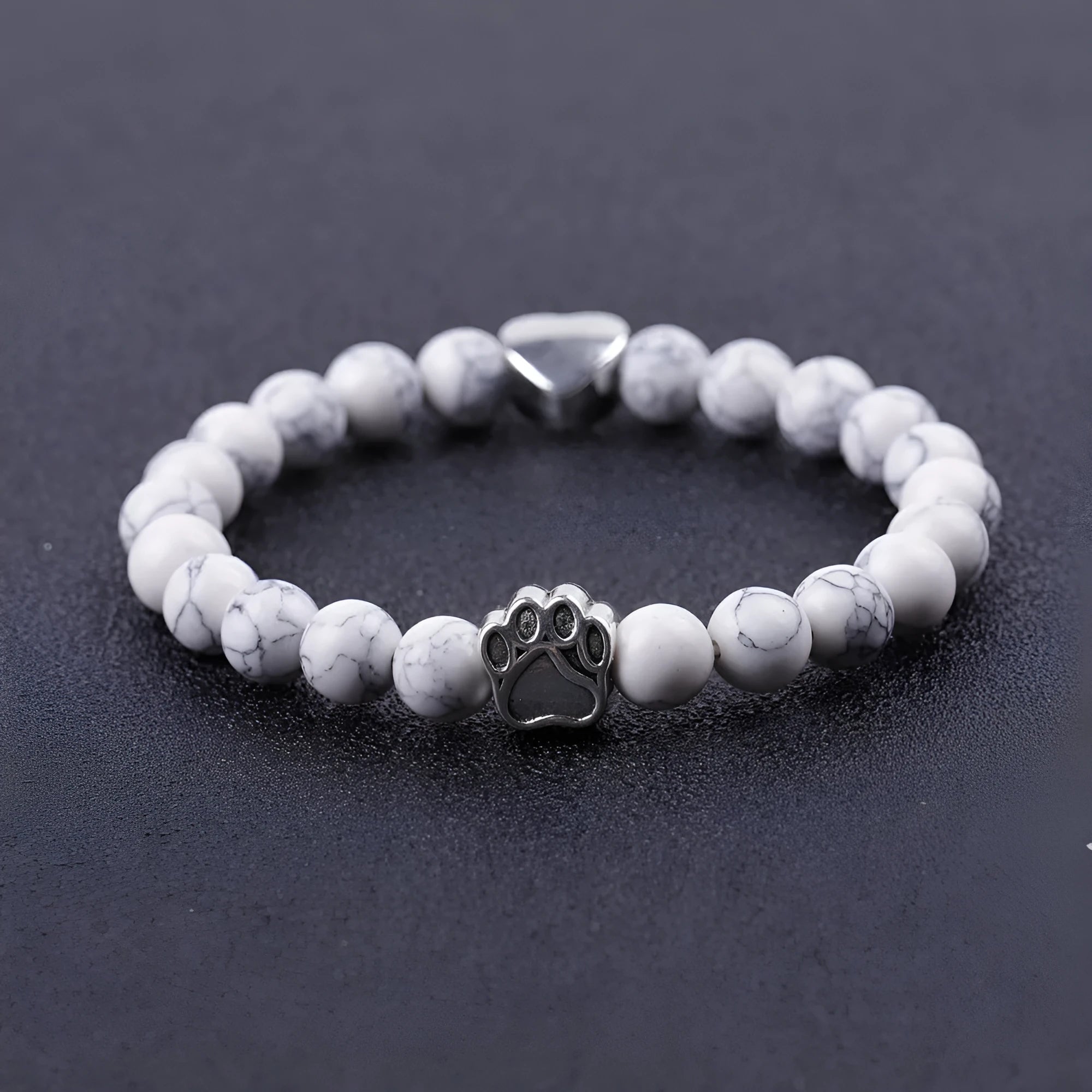 Tigereye Indian Agate stone bracelet with dog paw and love heart charms on wrist.
