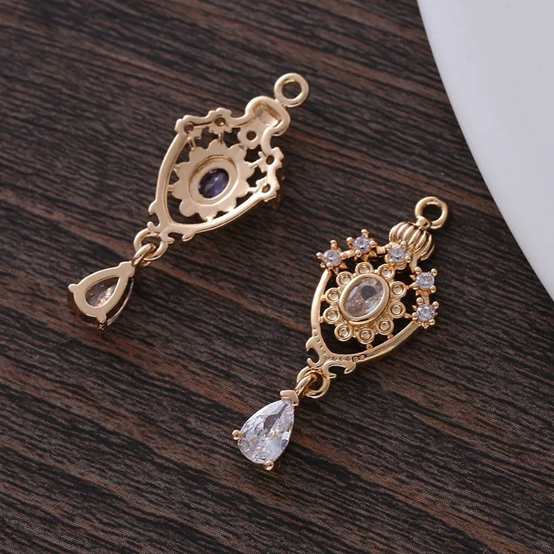 Water drop pendant with zircon crown detail in copper with electroplated finish.